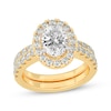 Thumbnail Image 0 of Lab-Created Diamonds by KAY Oval-Cut Halo Bridal Set 3 ct tw 14K Yellow Gold