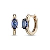 Thumbnail Image 1 of Oval-Cut Blue Lab-Created Sapphire Huggie Hoop Earrings 10K Yellow Gold
