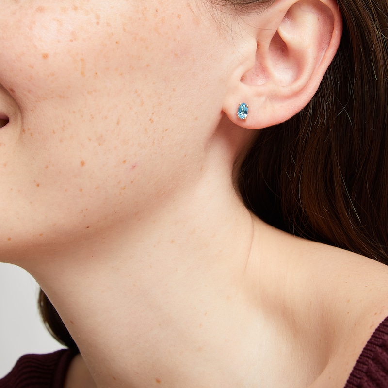 Main Image 3 of Oval-Cut Swiss Blue Topaz Solitaire Stud Earrings 14K Yellow Gold