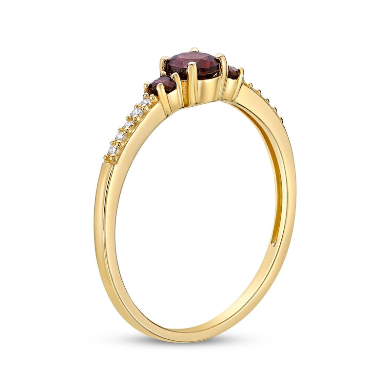 Main Image 2 of Garnet & 1/20 ct tw Diamond 3-Stone Ring 10K Yellow Gold