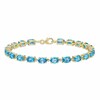 Thumbnail Image 0 of Swiss Blue Topaz Bracelet 1/15 ct tw Diamonds 10K Yellow Gold 7.25"