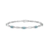 Thumbnail Image 1 of Oval-Cut Swiss Blue Topaz & White Lab-Created Sapphire Link Bracelet Sterling Silver 7.25&quot;