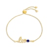 Thumbnail Image 0 of Blue Lab-Created Sapphire Zodiac Leo Bolo Bracelet 10K Yellow Gold 9.5"