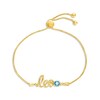 Thumbnail Image 1 of Swiss Blue Topaz Zodiac Leo Bolo Bracelet 10K Yellow Gold 9.5&quot;