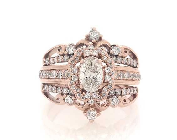 Previously Owned Oval-Cut Diamond Halo Bridal Set 1-1/4 ct tw 14K Rose Gold Size 6