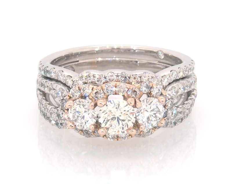 Main Image 1 of Previously Owned THE LEO Round-Cut Diamond Three-Stone Halo Bridal Set 1-7/8 ct tw 14K Two-Tone Gold Size 6.5