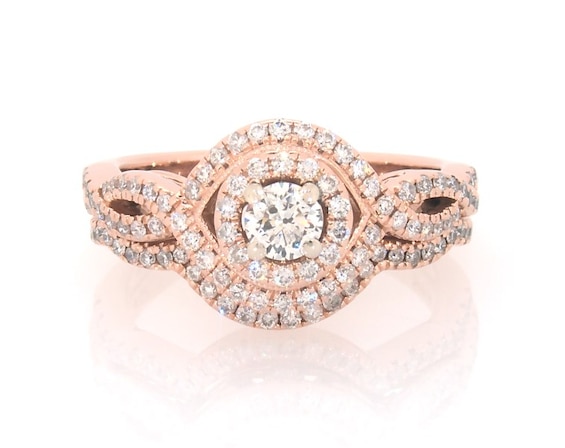 Previously Owned Round-Cut Diamond Halo Twist Bridal Set 3/4 ct tw 14K Rose Gold 5.5