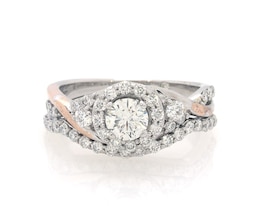 Previously Owned THE LEO Diamond Round-Cut Halo Bridal Set 1-1/5 ct tw 14K Two-Tone Gold Size 7.5