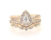 Thumbnail Image 1 of Previously Owned Pear-Shaped Diamond Halo Bridal Set 5/8 ct tw 14K Yellow Gold Size 3.75